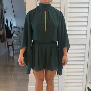Dark forest green bell sleeve romper with neck tie feature